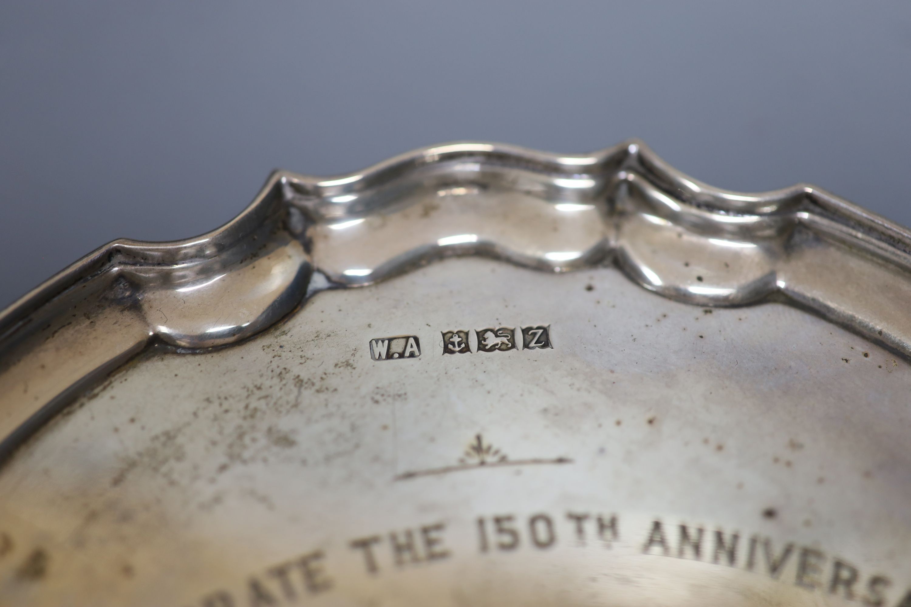 A modern silver presentation waiter, 15.5cm and a George V silver tri-handles bowl, 9oz.